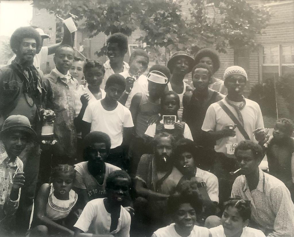 Damaged snapshot of a large group of young people, original