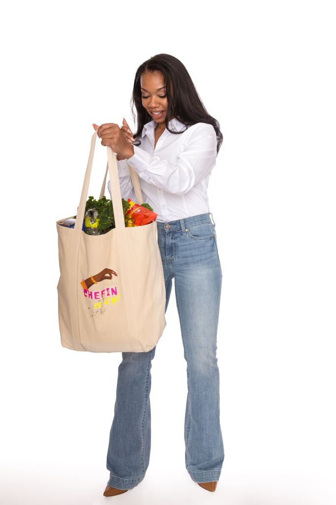 Founder holding her branded tote