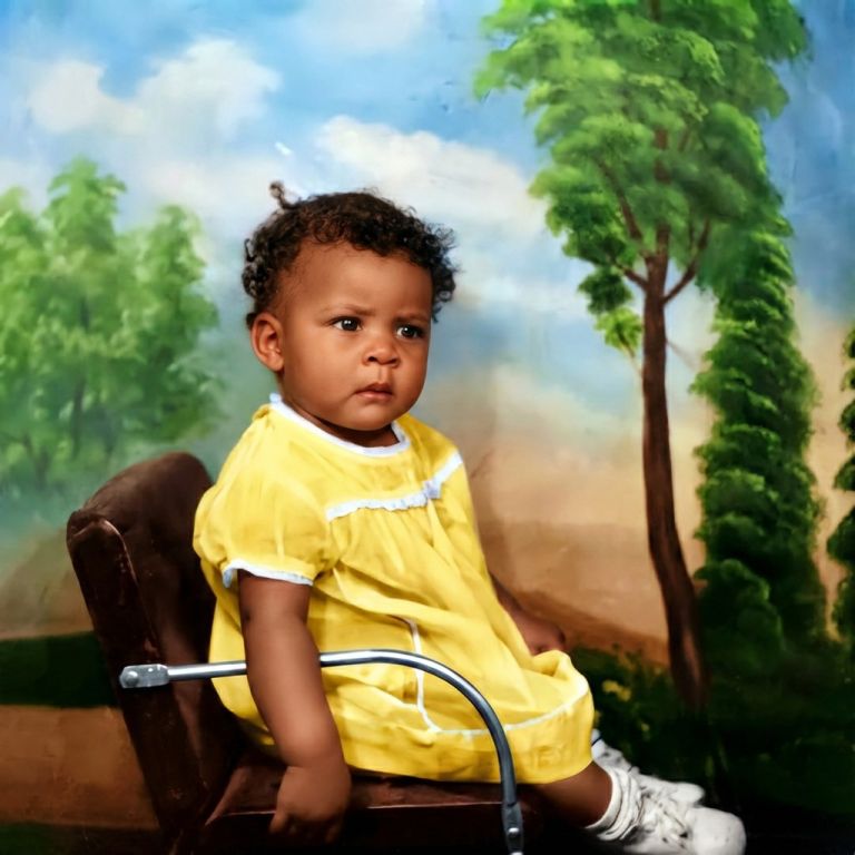 Restored and colorized vintage photo: Toddler in a yellow outfit