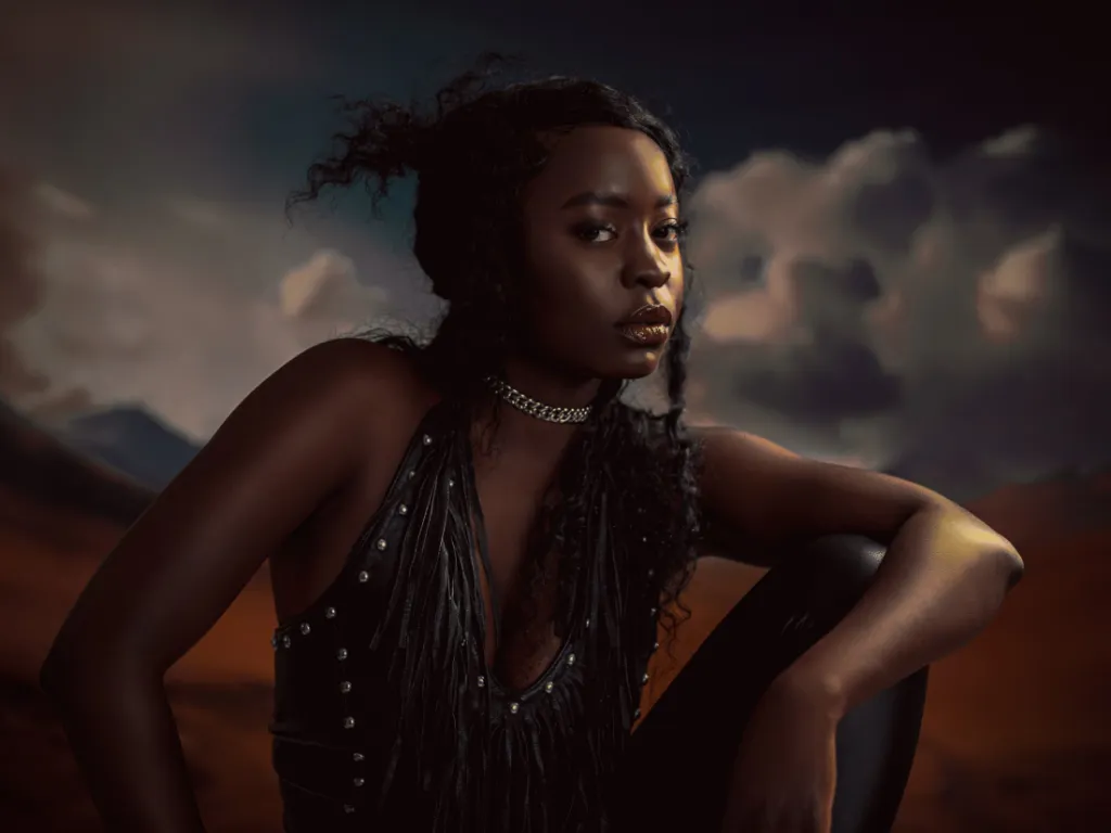 Portrait at golden hour under a dramatic sky