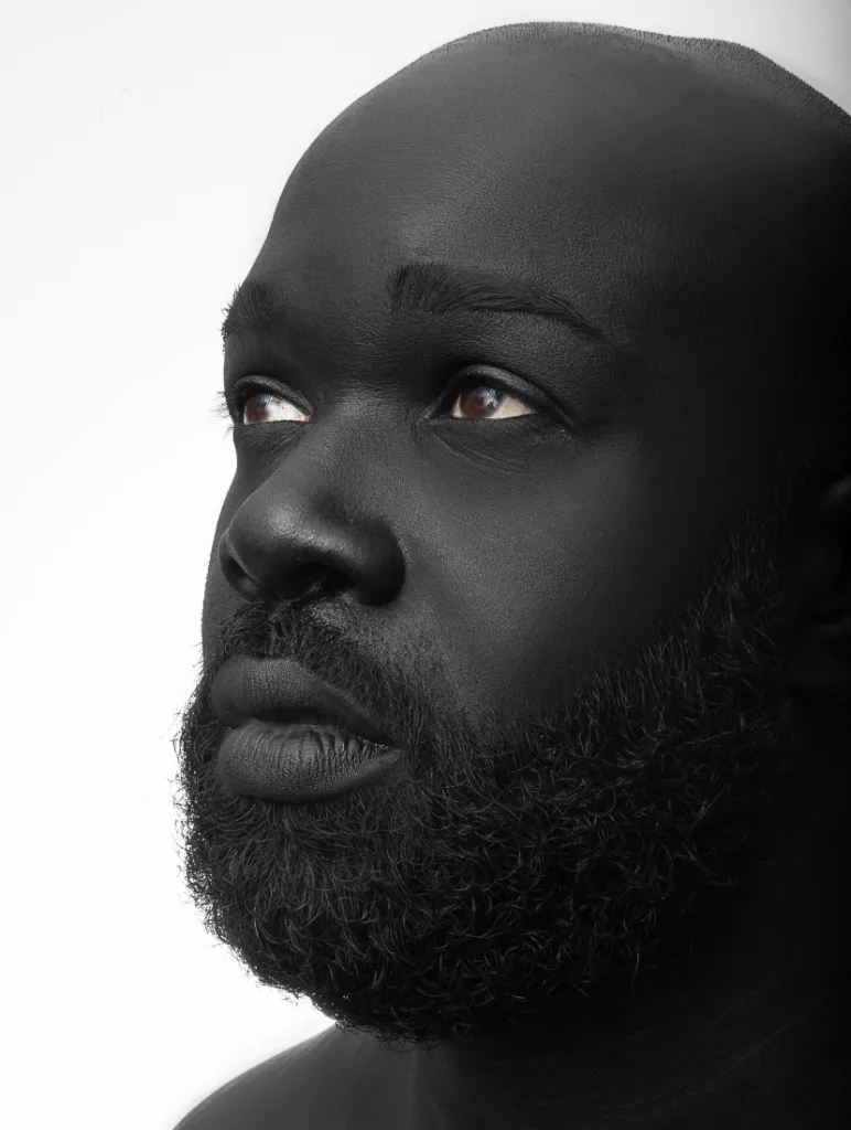 Black-and-white portrait of a bearded man